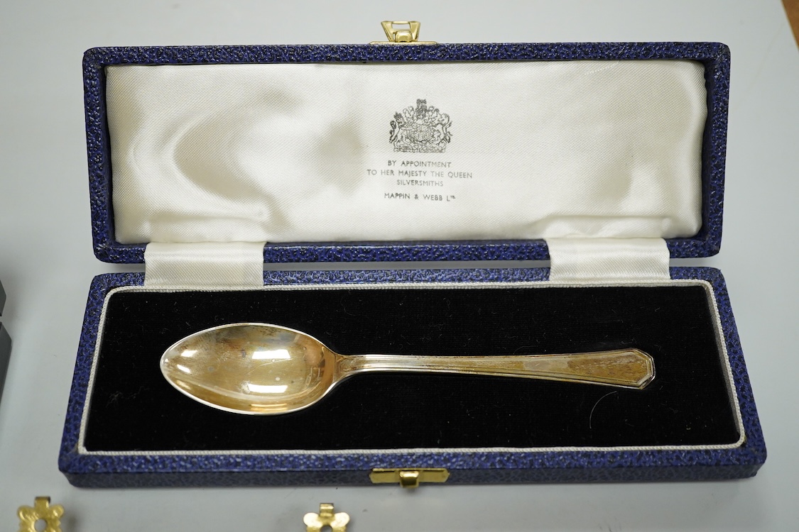 A Portuguese white metal 916 standard circular box and cover, retailed by Joalharia Do Carmo, diameter 94mm, together with cased set of six silver plated coffee spoons, a cased silver teaspoons, a Victorian silver christ
